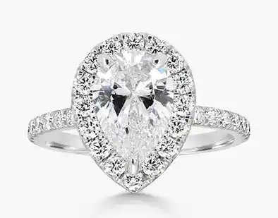 platinum engagement ring with pear center cut diamond and halo setting