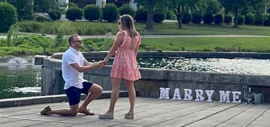 A man proposing to a woman with a Solitaire Engagement Ring