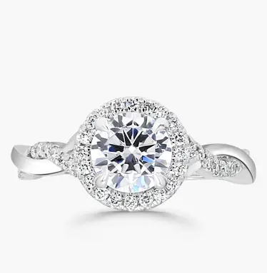 halo engagement ring with a twisted band in white gold and round-cut diamond