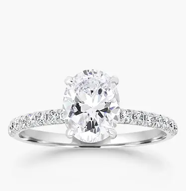 pave engagement ring in white gold with oval-cut diamond